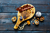 Ingredients for making rich winter hot chocolate with cinnamon sticks and walnuts