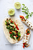 Grilled flatbreads filled with mussels and vegetables