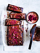 Chocolate and buttermilk slab cake with freezed raspberries
