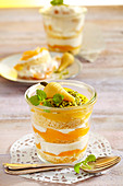 Apricot and quark layer cake in a jar decorated with a marzipan carrot