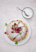Hazelnut and chocolate pie with raspberries