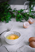 Raw eggs on marble tabletop