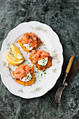Potato fritters with crème fraîche and salmon