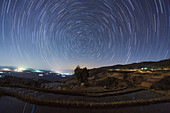 Star trails over rice terraces in China