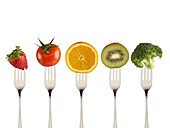 Fresh fruit and vegetables on forks