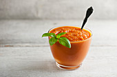 Roasted carrot soup with basil leaf