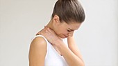 Woman rubbing painful shoulder