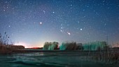 Orion constellation rising over a lake, time-lapse footage