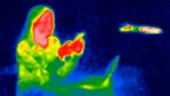 Person on phone thermographic