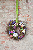 Wreath of maidenhair vine tendrils and spring flowers