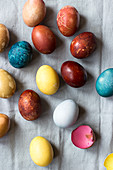Eggs, coloured with natural dyes: Blue - red cabbage, yellow - turmeric, brown - red onion, red - beets, light green - spinach, light brown - tea
