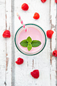 Raspberry lassi with mint leaves