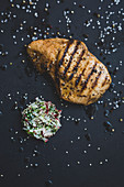 Grilled chicken breast with caramelised radishes (seen from above)