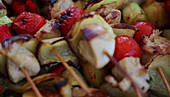 Grilled skewers on a bed of potatoes