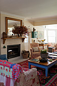 Cosy living room in country-house style with open fireplace