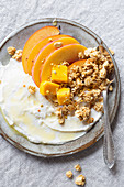 Greek yogurt, peach, mango and granola with honey and bee pollen, gluten free