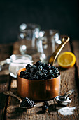 Preparing blackberries jam