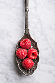 Raspberries on vintage spoon