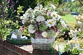 Summer bouquet of daisies, dahlias, cartilage carrots, honorary awards and sterling umbels