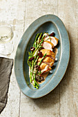 Corn-fed chicken in a creamy morel mushroom sauce with fried green asparagus
