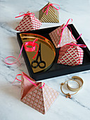 Homemade pyramid boxes as gift boxes or as table decorations