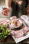 Vanilla ice cream with streusel and raspberries