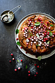 Upside down apple and walnut cake with redcurrants