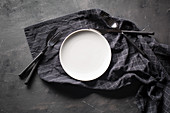 Empty dish seen from above with cutlery