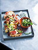 Ciabatta pizzas with salami, balsamic mushrooms and rocket