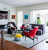 Seating, coffee table and man with dog in the living room