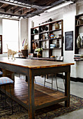 Cat on a rustic wooden table in a vintage style loft