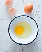 A egg in an enamel bowl