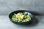 Fusilli with spinach sauce and egg
