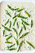 Lemon and basil sauce with green asparagus