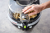 A hot-air fryer being closed
