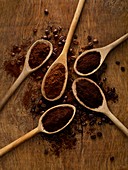 Wooden spoons with ground coffee