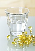 Evening primrose oil capsules and water