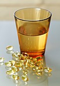 Evening primrose oil capsules and water