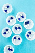 Drug capsules in paper medicine pots
