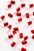Red and white drug capsules