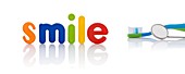 The word 'smile' in multicoloured letters with toothbrush