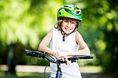 Boy sitting on bicycle