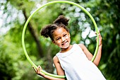 Girl playing with hula hoop