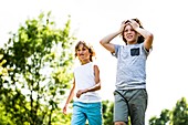 Boys walking in park