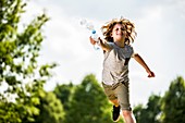 Boy splashing water