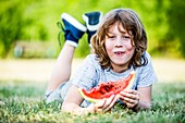 Boy eating watermelon