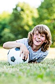 Boy playing with football