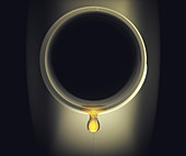 Engine oil dripping from a bottle, illustration