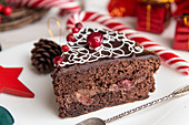 Slice of sweet chocolate cake for Christmas Eve