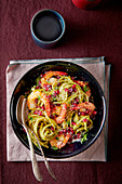 Linguine with prawns and pomegranate seeds